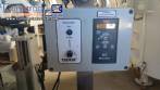 Automatic self-adhesive labeling machine for cylindrical bottles