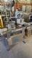 Automatic self-adhesive labeling machine for cylindrical bottles