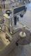 Automatic self-adhesive labeling machine for cylindrical bottles