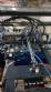 Pick and place product feeder for flowpack transfer cartoning machine