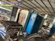 Automatic baling machine with shrink tunnel for bottles and jars in bales.