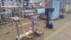 Filling machine with 2 nozzles for liquids and pilfer cap screwer