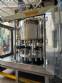 Packaging line with IMSB bung capper, Maqmundi labeler and accumulator table