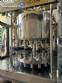 Stainless steel rotary filling machine with 16 IMSB nozzles for bottles and jars