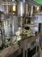 Gravimetric rotary filling machine in stainless steel with cabin