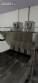 Automatic stainless steel deep fryer for donuts and cream puffs.