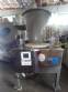 Erli rotary liquid filling machine with 4 pistons, 14,400 units per hour.