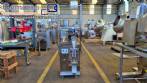 Dosing and packaging machine for granular and powdered products