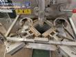 Vertical wrapping machine for triangular format