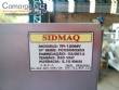 Tempering machine with cover plate coupled to Sidmaq