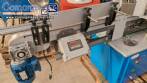 Automatic double-head labeling machine for cylindrical and flat bottles, Tudela, 3,000 labels per hour.