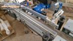 Automatic double-head labeling machine for cylindrical and flat bottles, Tudela, 3,000 labels per hour.