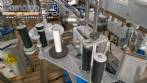 Automatic double-head labeling machine for cylindrical and flat bottles, Tudela, 3,000 labels per hour.