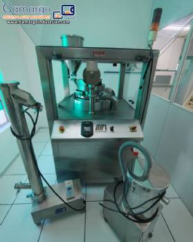 Neuberger rotary tablet press, 20 punches, 900 tablets per minute.