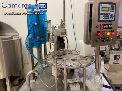 Stainless steel rotary sealer with aluminum seal for Delgo jars, cups and bottles.