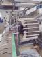 Hoppmann bottle positioner with conveyor belt