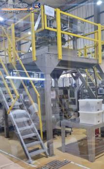 Masipack 16 Twin multi-head vertical packaging machine with conveyor belt and platform.