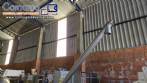 Inclined screw conveyor with stainless steel silo