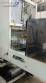 Labeling machine with steam sleeve tunnel and bottle baler