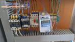 Labeling machine with steam sleeve tunnel and bottle baler