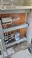 Labeling machine with steam sleeve tunnel and bottle baler