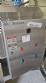 Labeling machine with steam sleeve tunnel and bottle baler