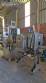 Labeling machine with steam sleeve tunnel and bottle baler
