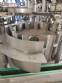 Zegla rotary filling machine with rinser and three-block capping system.