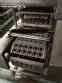 Automatic filling and sealing machine for gelatin cups, 12,000 units/hour.