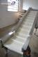 Stainless steel belt with MCI cleat