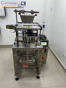 Automatic volumetric dosing packaging machine for powder products. Automatic volumetric dosing packaging machine for powder products.