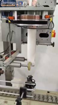 Label applicator machine with steam-operated shrink tunnel for sleeves. Label applicator machine with steam-operated shrink tunnel for sleeves.