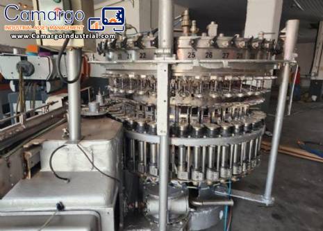 Stainless steel rotary filling machine for carbonated beverages and soft drinks, 60 nozzles, KHS with Zegla washer. Stainless steel rotary filling machine for carbonated beverages and soft drinks, 60 nozzles, KHS with Zegla washer.